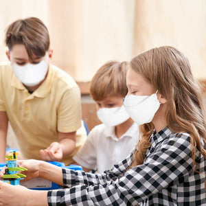 group of kids wearing kf94 masks